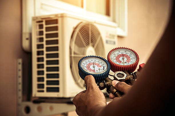 Professional Heat Pump Repair technician working in Mashpee, MA